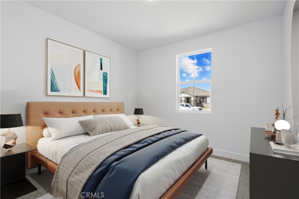 1872 Vincent Drive Palmdale, CA 93551 - Photo 8 of 10 a bedroom with a bed and a painting on the wall