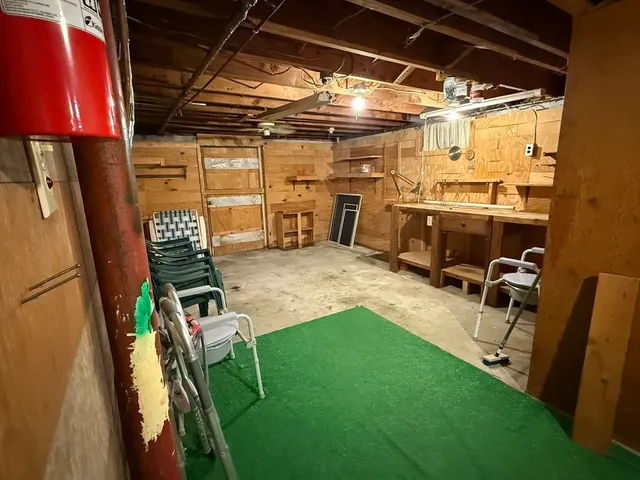 a view of a room with chairs and a table