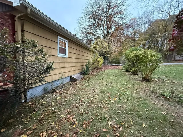 a backyard of a house with lots of green space