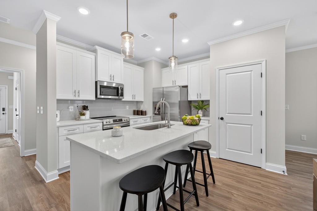 17 Sparks Way Austell, GA 30106 - Photo 15 of 69 a kitchen with white cabinets and stainless steel appliances
