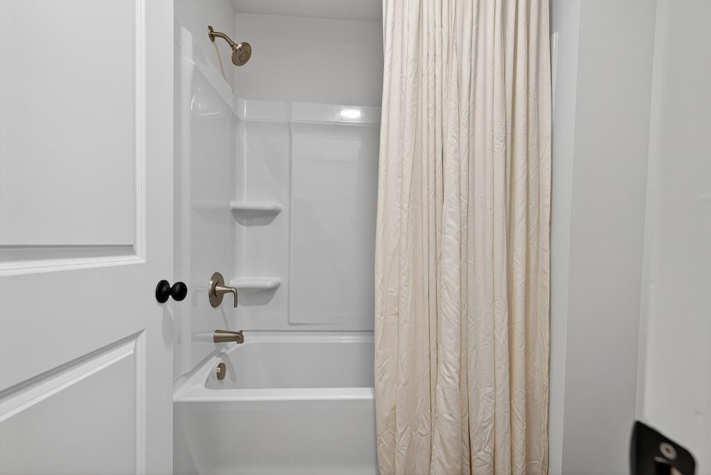 17 Sparks Way Austell, GA 30106 - Photo 32 of 69 a white bath tub sitting next to a white sink and vanity