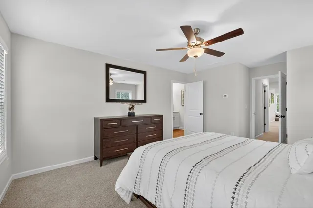 an aerial view of water body with boats and residential houses with outdoor seating