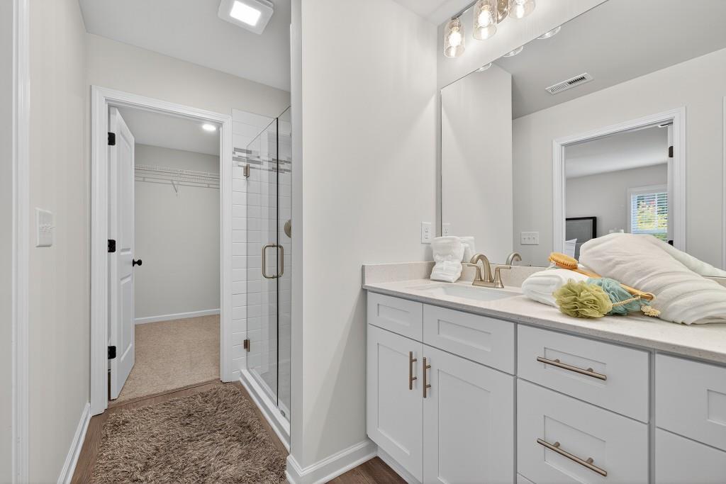 17 Sparks Way Austell, GA 30106 - Photo 39 of 69 a en suite bathroom with a granite countertop sink and a mirror