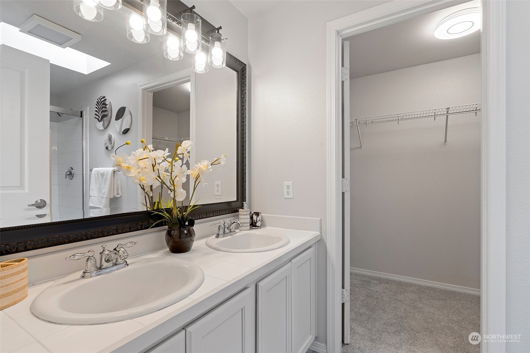226 Whitman Place Northeast Renton, WA 98059 - Photo 17 of 26 a bathroom with a sink and a mirror