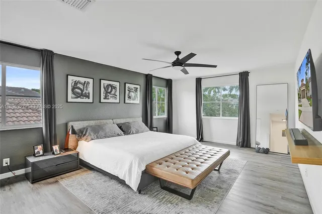 a bedroom with bed and a window