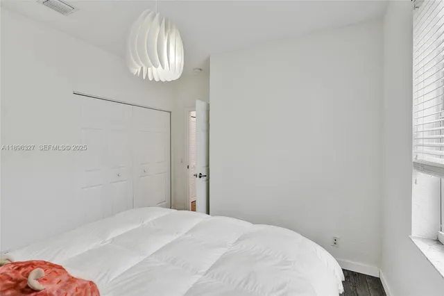 a bathroom with a toilet and a bathtub