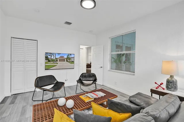 an aerial view of multiple houses with yard