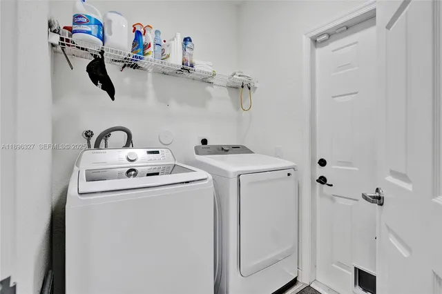 an aerial view of a house with garden space and street view