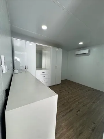 a view of a livingroom with wooden floor