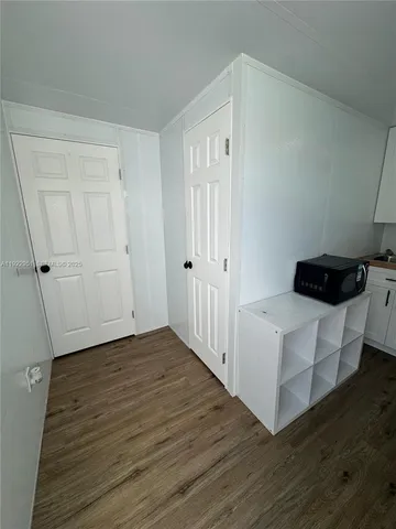 a kitchen with a table and chairs