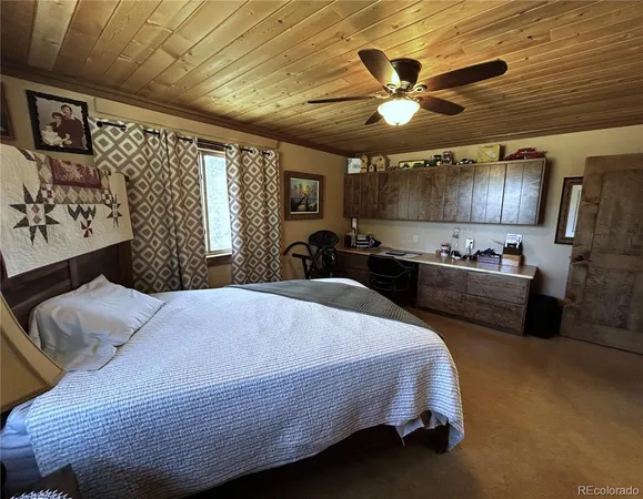 a bedroom with a bed and a large mirror