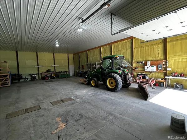a view of a garage with parked cars