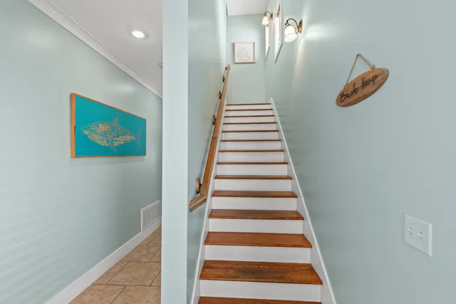 a living room with furniture flat screen tv and window