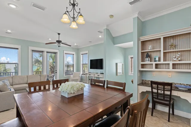 a large kitchen with kitchen island a stove a table and chairs