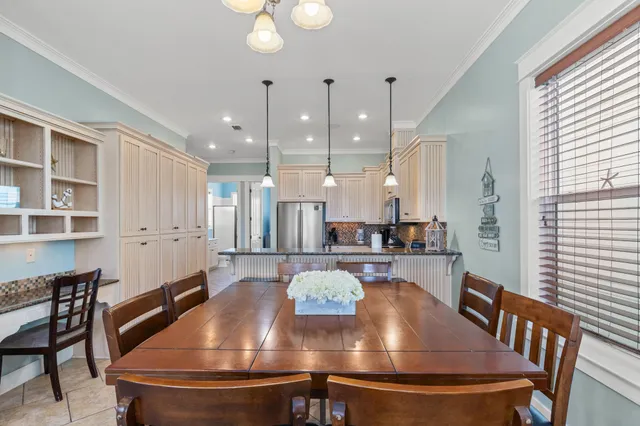 a kitchen with stainless steel appliances granite countertop a refrigerator a stove a sink and a microwave