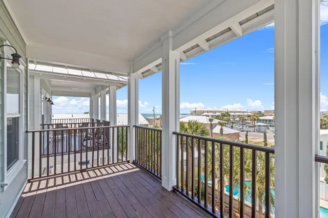 a view of a balcony with wooden floor