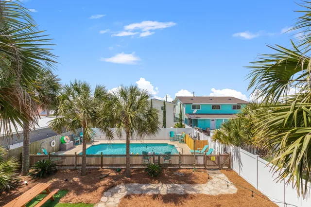 a terrace with outdoor seating and trees