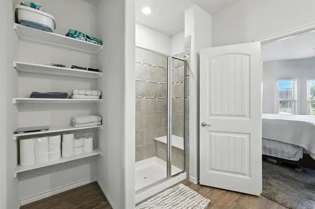 a view of room with a ceiling fan and window