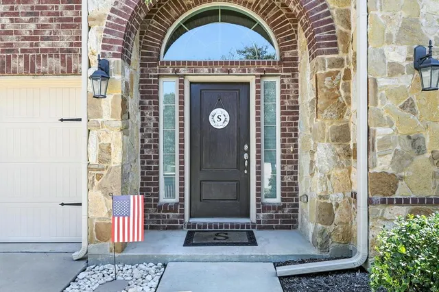 a front view of a house with a glass door