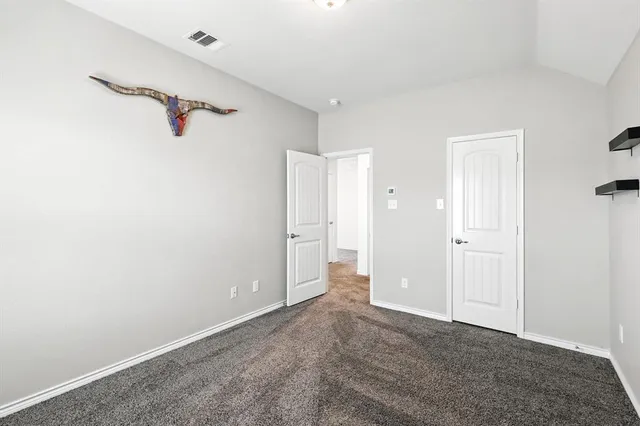 a view of a patio with a table chairs and a garden