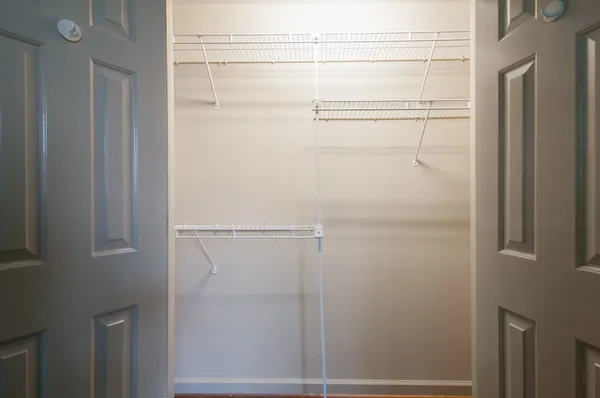 a view of an empty walk in closet