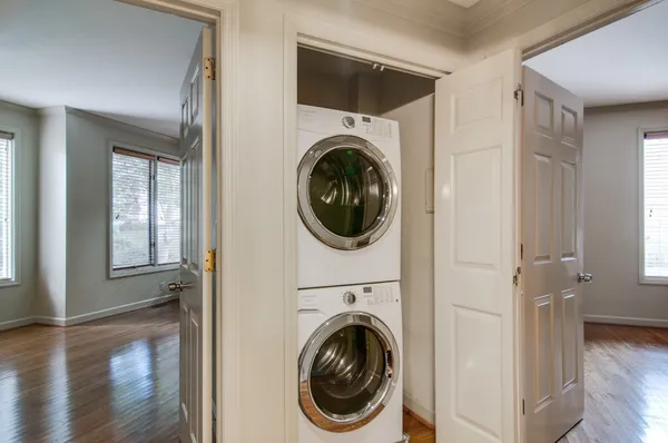 a view of a hallway with washer and dryer