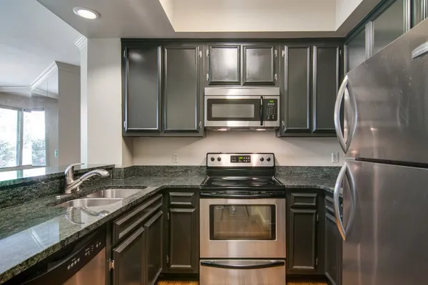 a kitchen with a stove microwave and refrigerator