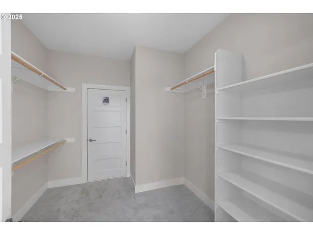a utility room with cabinets washer and dryer