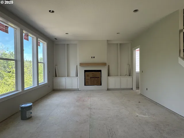 a bathroom with a sink a toilet a mirror and shower