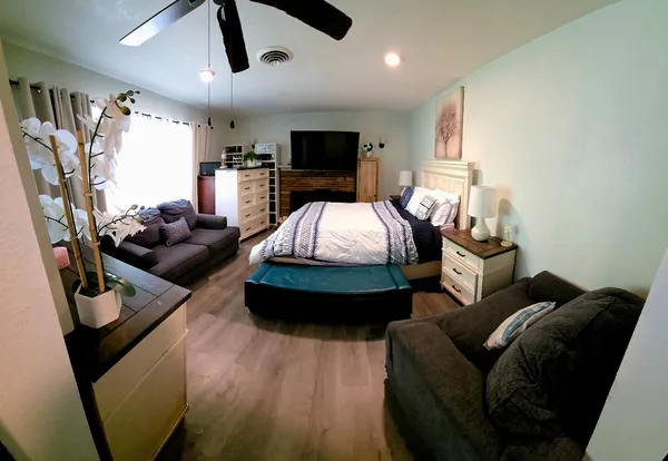 a bed room with two beds and a chandelier
