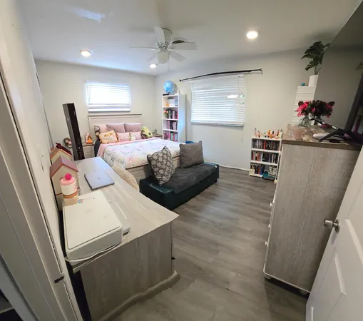 a bed room with a bed and a book shelf