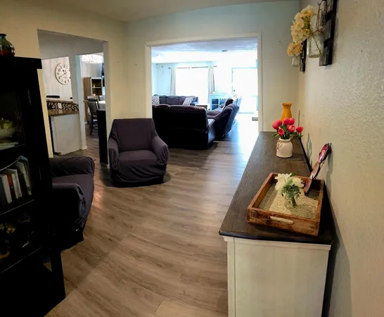 a living room with furniture or couch and a flat screen tv