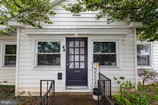 a front view of a house with large windows
