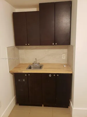 a bathroom with a sink and mirror