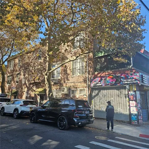 a view of a cars park in front of a house