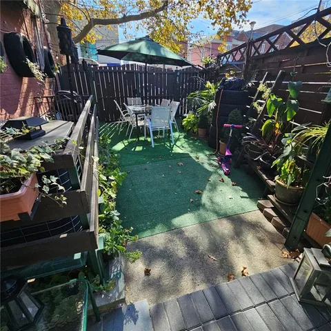 a view of a backyard with sitting area