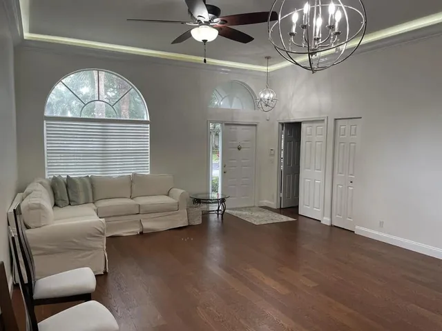 a living room with furniture and a large window