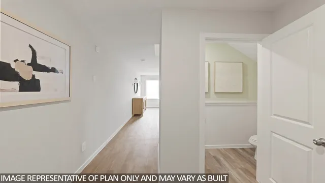 a view of a hallway with wooden floor and closet