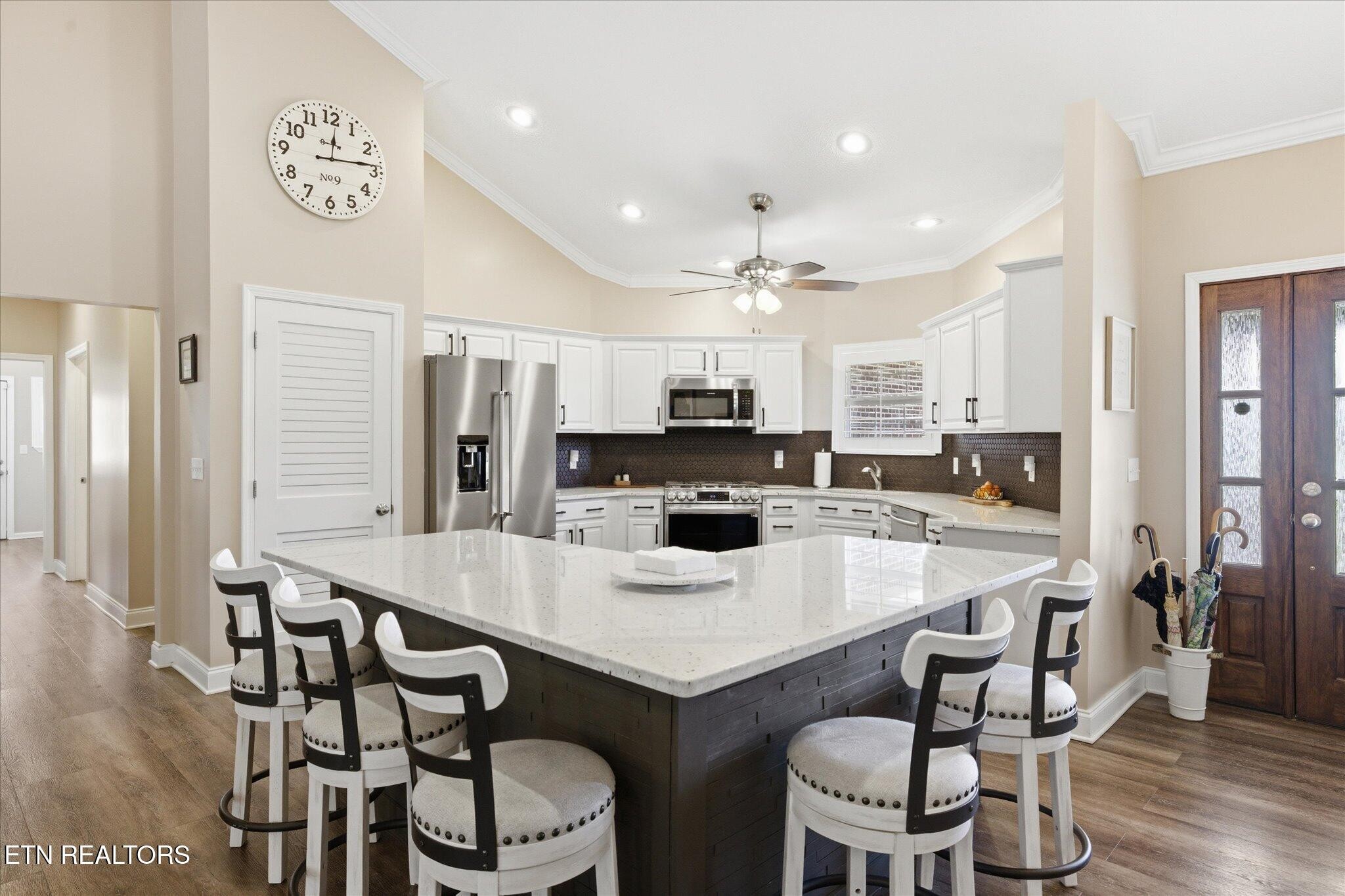 1330 Rippling Waters Circle Sevierville, TN 37876 - Photo 11 of 53 a kitchen with a dining table chairs and refrigerator