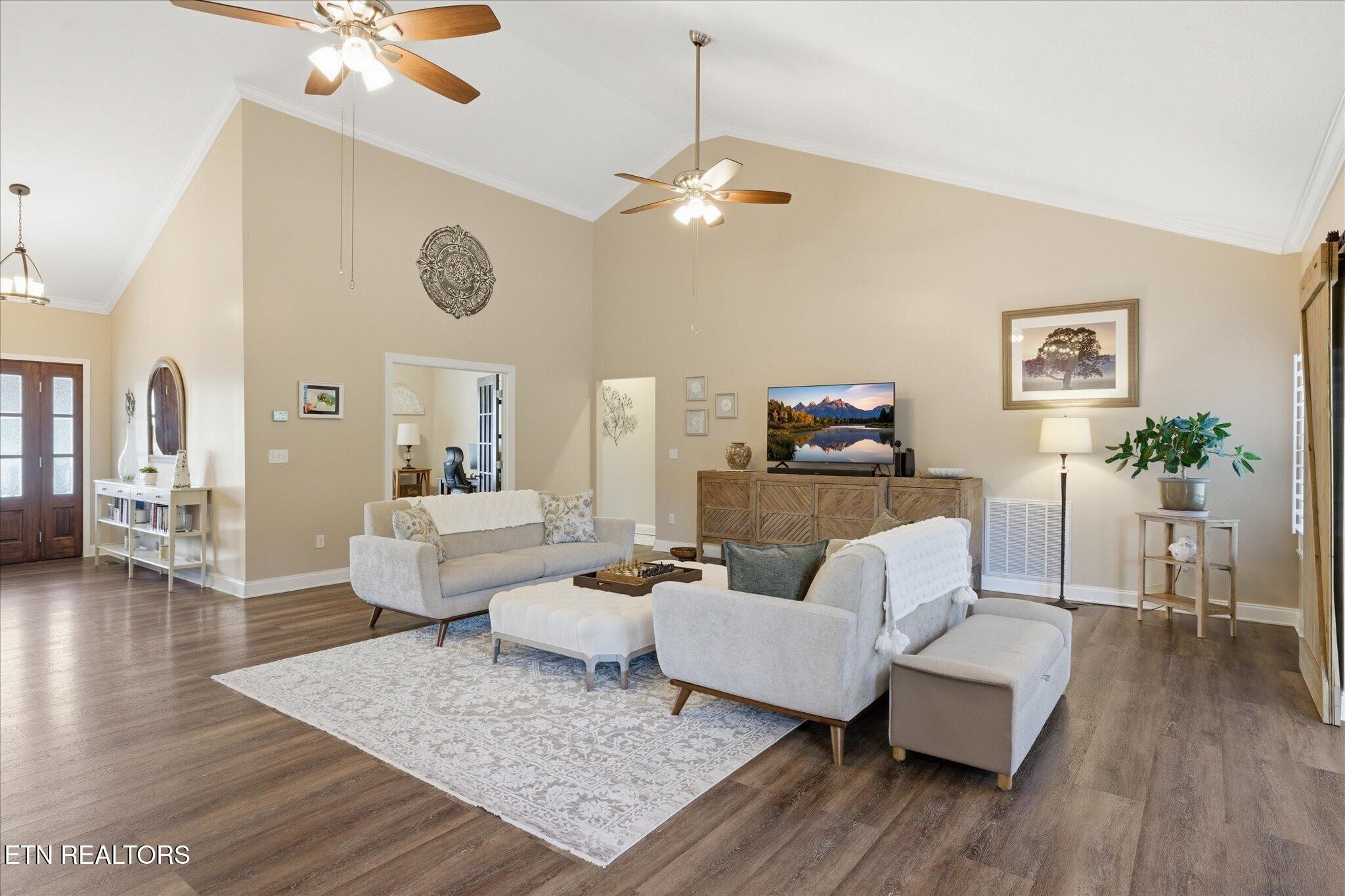 1330 Rippling Waters Circle Sevierville, TN 37876 - Photo 20 of 53 a living room with couches and a table with wooden floor