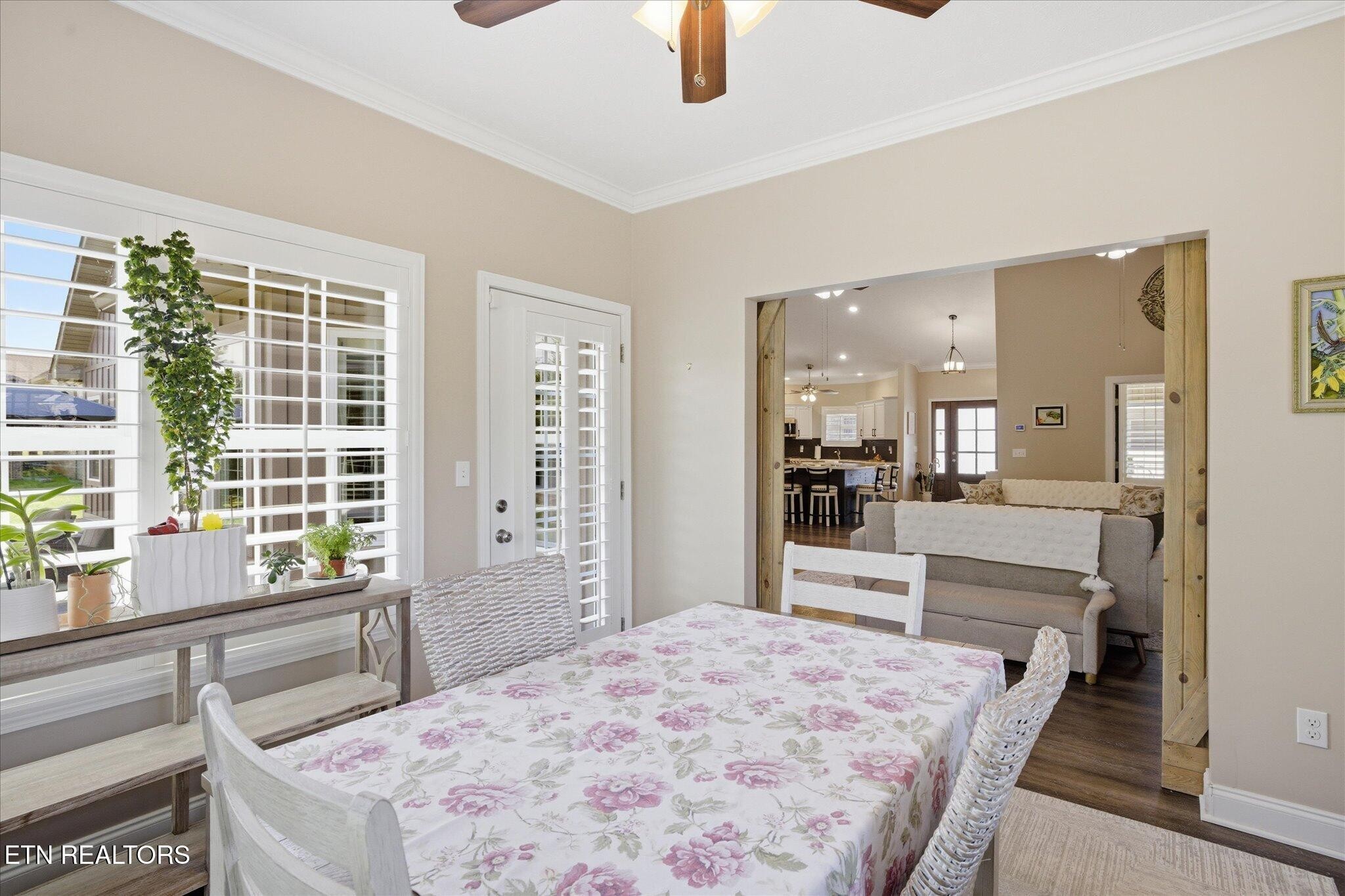 1330 Rippling Waters Circle Sevierville, TN 37876 - Photo 27 of 53 a bedroom with a bed and large window with kitchen view