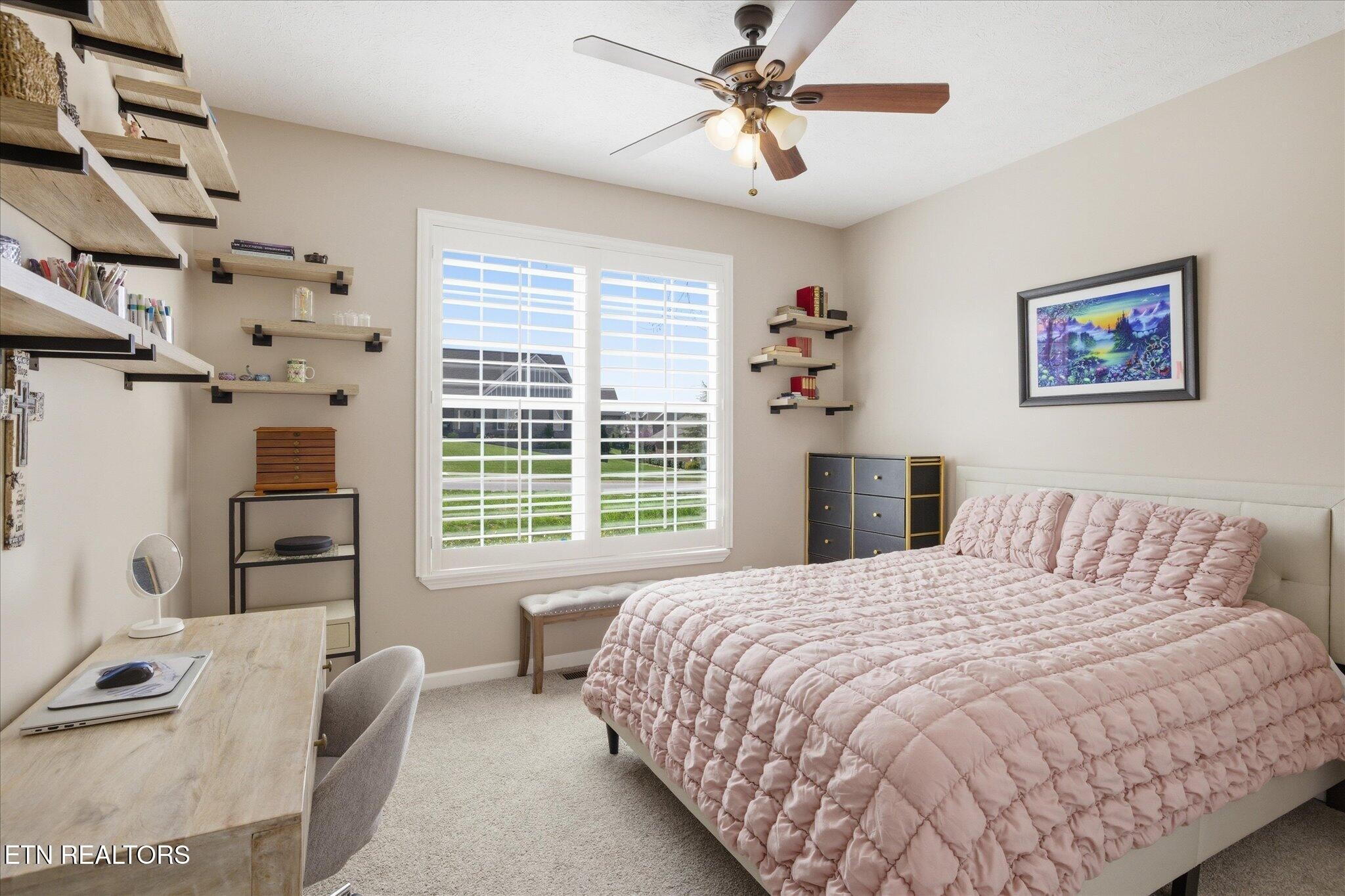 1330 Rippling Waters Circle Sevierville, TN 37876 - Photo 30 of 53 a bedroom with a bed couches and a flat tv screen