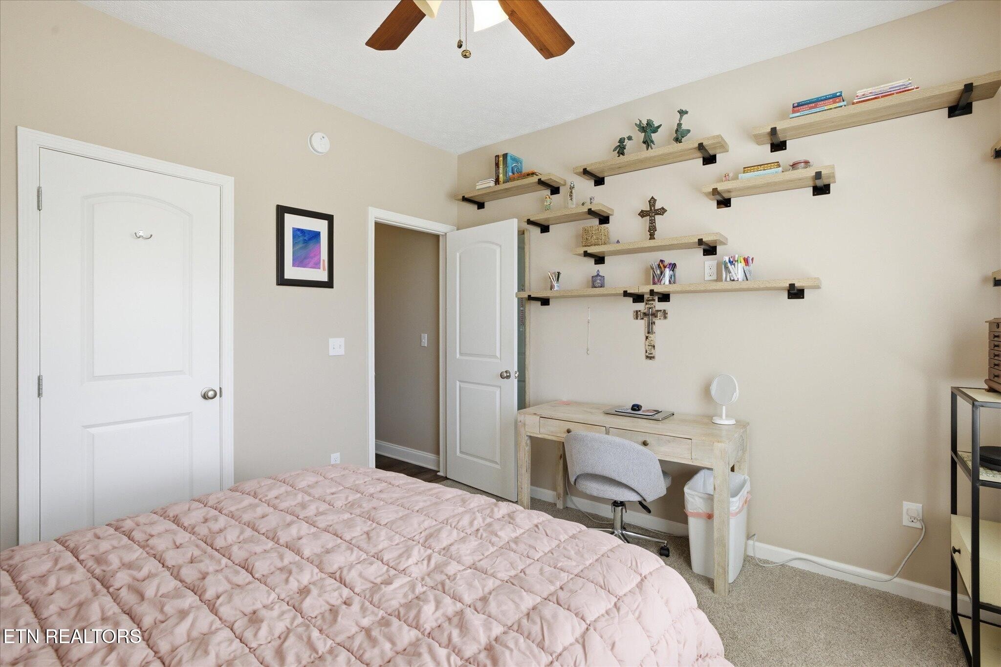 1330 Rippling Waters Circle Sevierville, TN 37876 - Photo 31 of 53 a bedroom with a bed and a chandelier