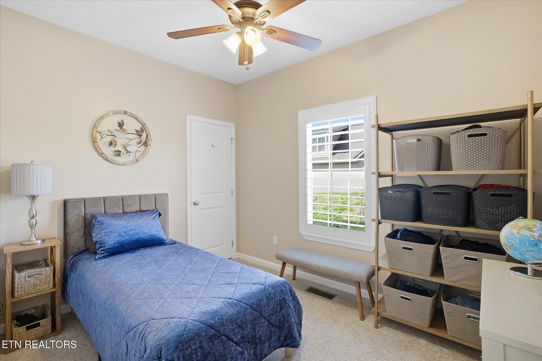 1330 Rippling Waters Circle Sevierville, TN 37876 - Photo 32 of 53 a bedroom with a bed and a chandelier