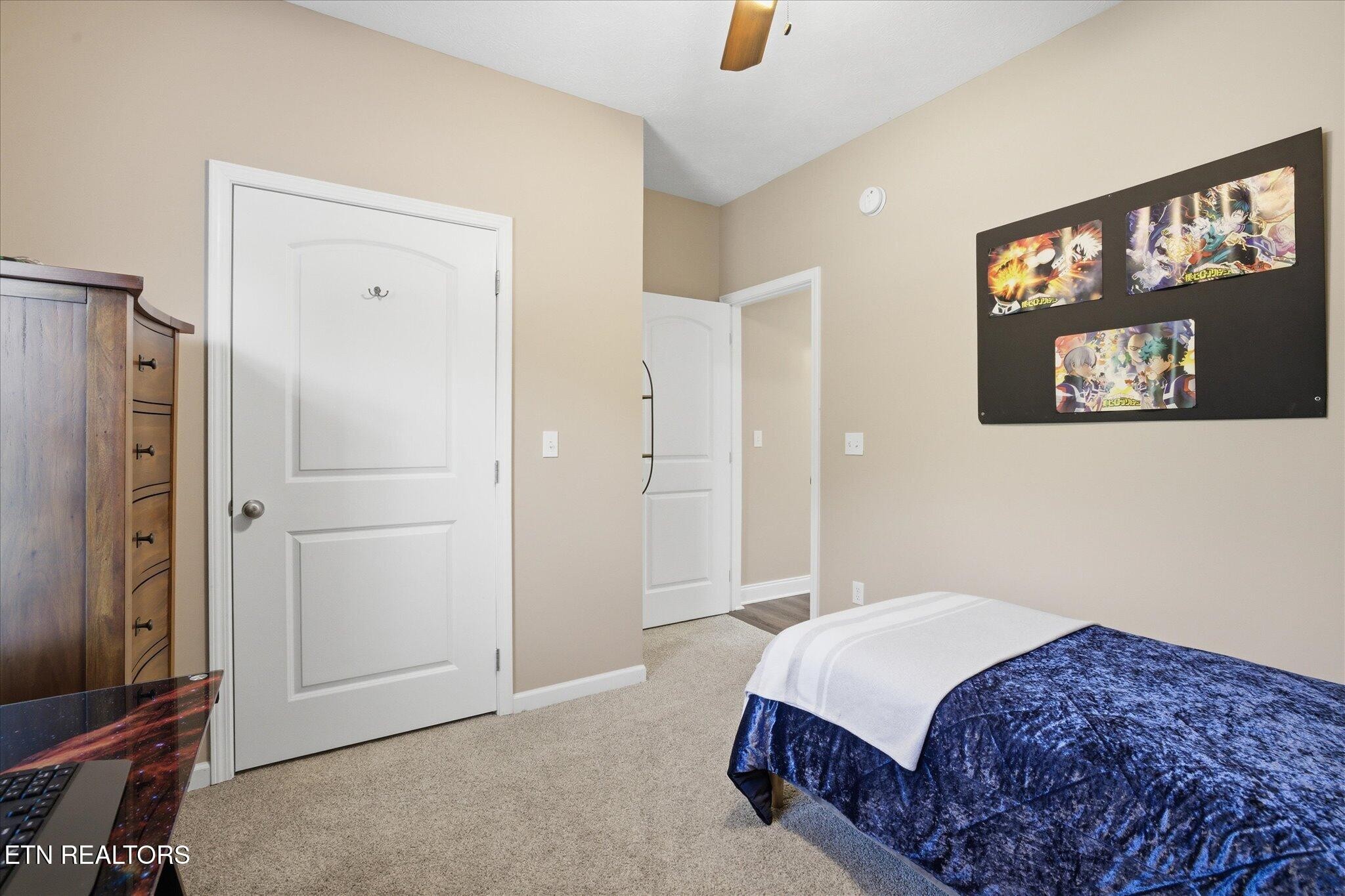 1330 Rippling Waters Circle Sevierville, TN 37876 - Photo 37 of 53 a bedroom with a bed and a painting on the wall