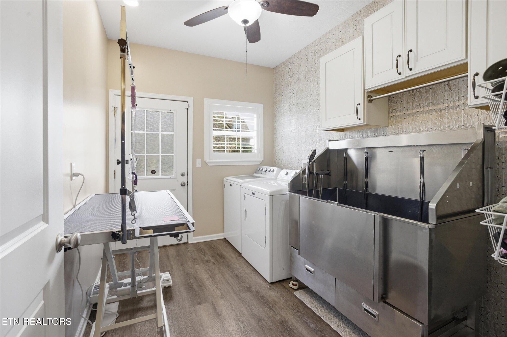 1330 Rippling Waters Circle Sevierville, TN 37876 - Photo 39 of 53 a kitchen with sink cabinets and wooden floor