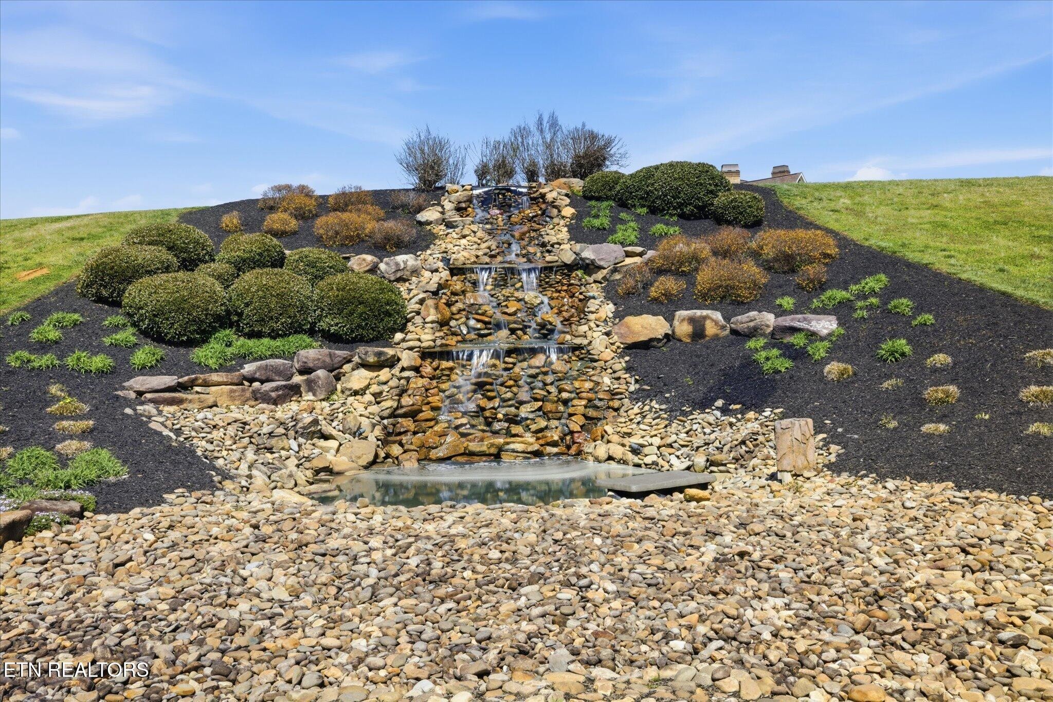 1330 Rippling Waters Circle Sevierville, TN 37876 - Photo 51 of 53 a view of a garden with a tree