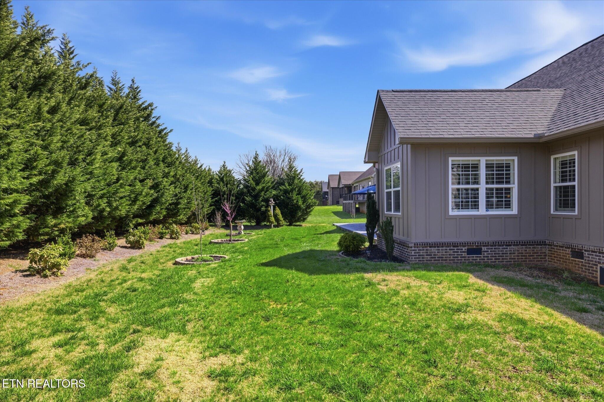 1330 Rippling Waters Circle Sevierville, TN 37876 - Photo 7 of 53 a view of a house with backyard and garden