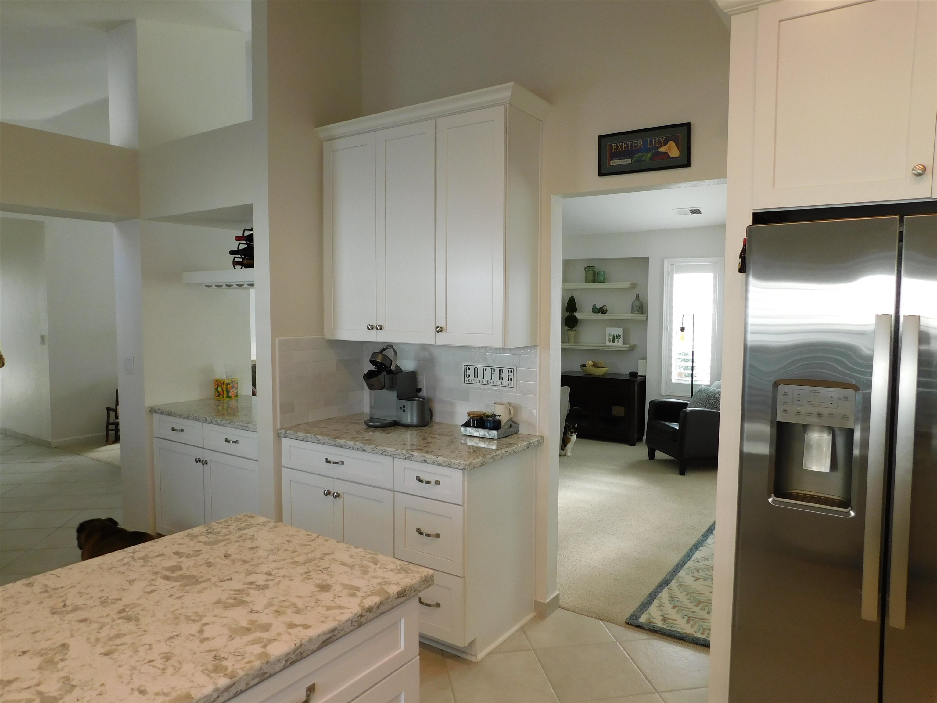 1169 Copper Cottage Lane Modesto, CA 95355 - Photo 11 of 42 a kitchen with a sink refrigerator and cabinets