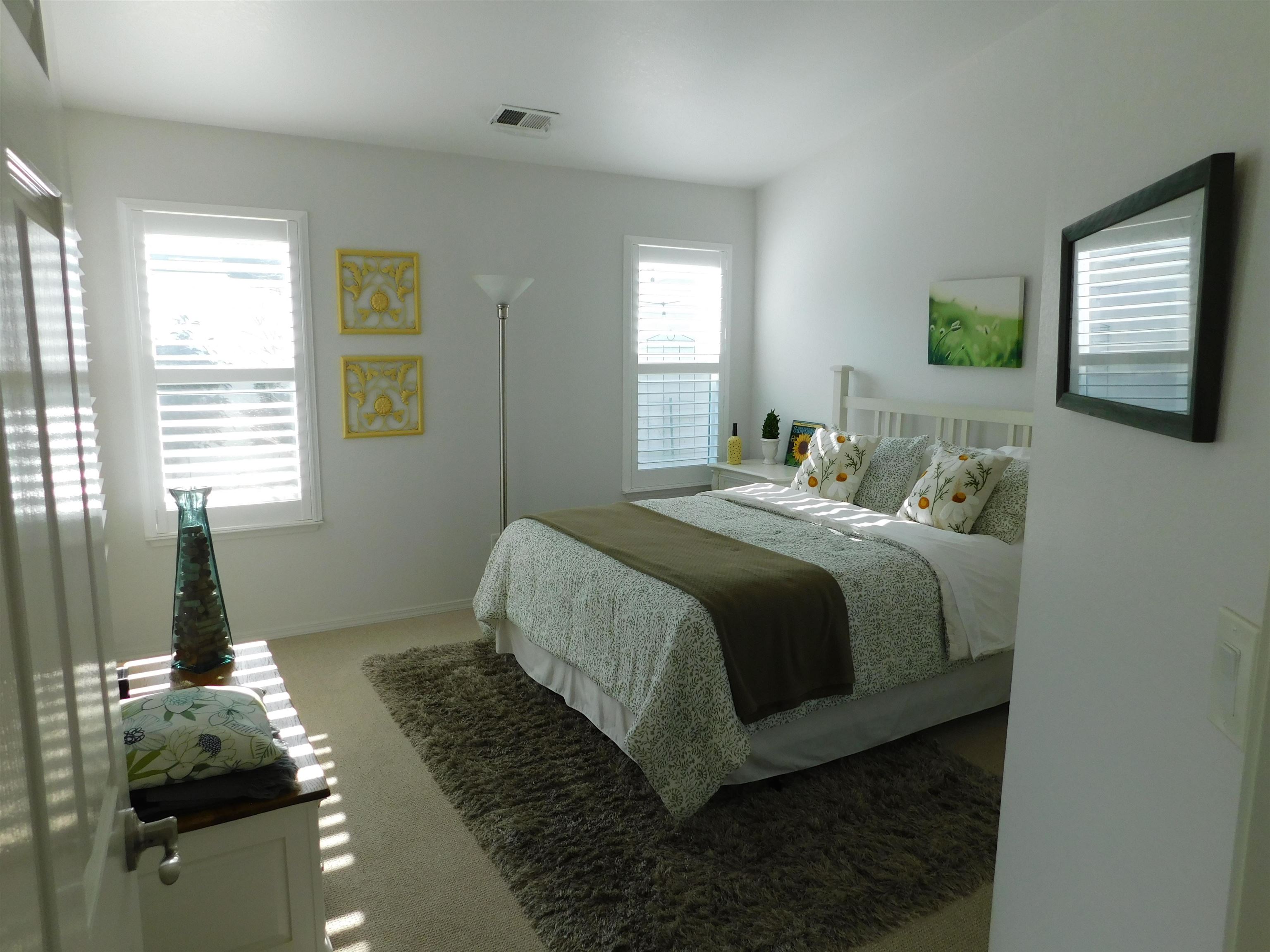 1169 Copper Cottage Lane Modesto, CA 95355 - Photo 16 of 42 a bedroom with a bed and window